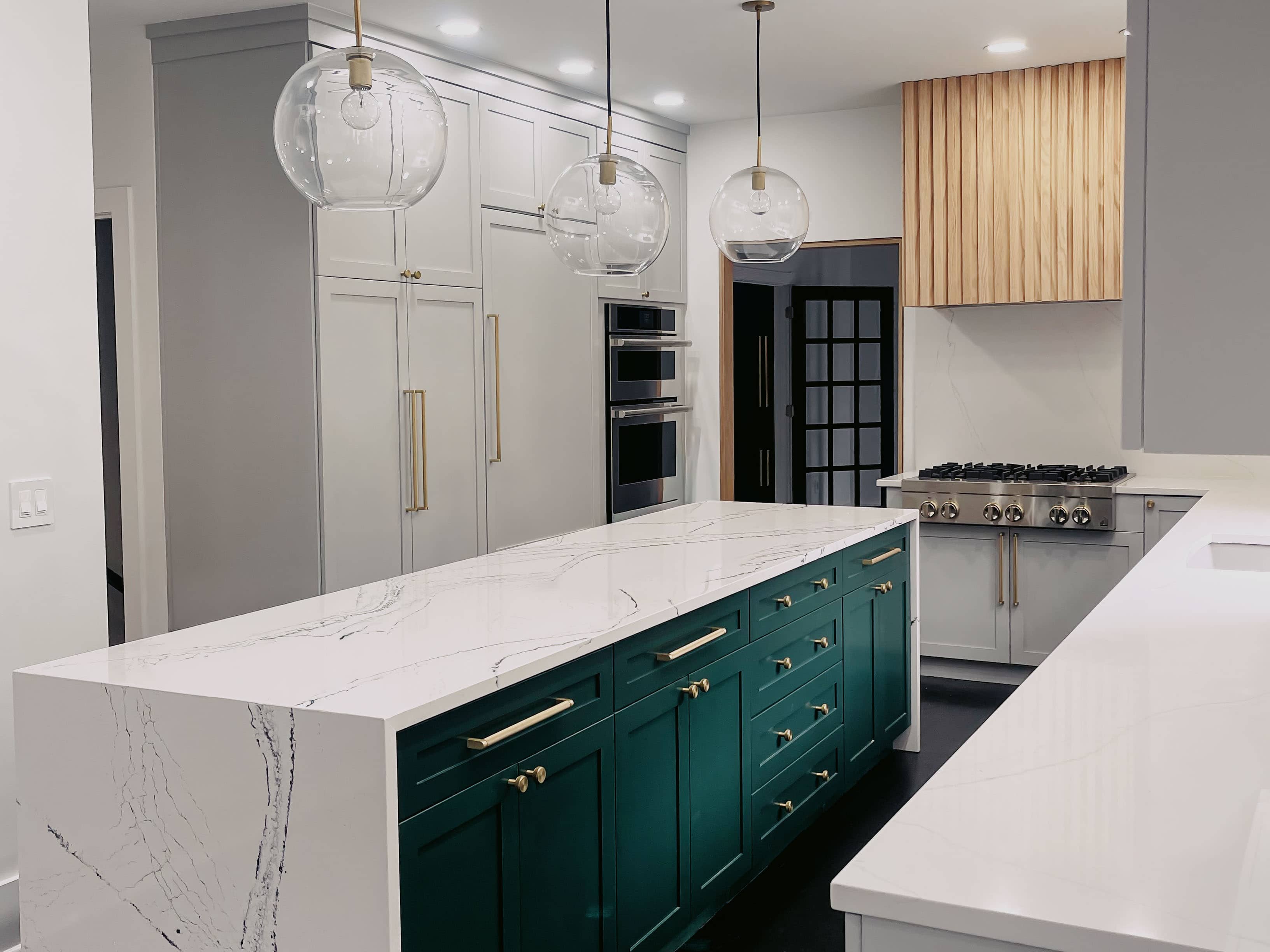 GM Cabinetry custom kitchen with white shaker cabinets, marble island, and gold hardware in Snellville Georgia